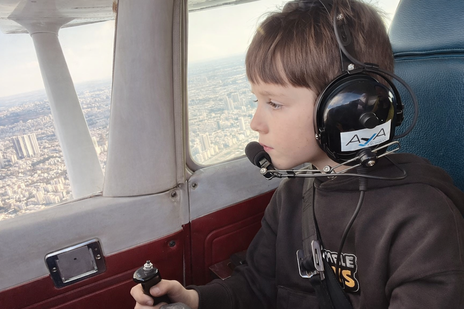 Tyler Levin in the cockpit with aviation headset
